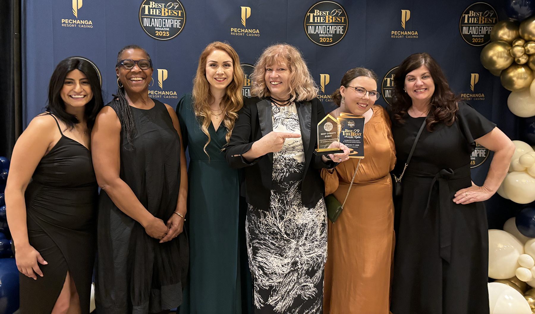 CFA staff and board members pose with trophy